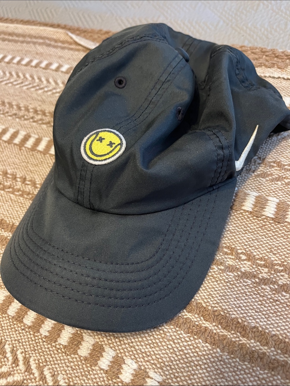 Nike Woman’s Black Cap with Yellow Smiley Patch Tennis Ball